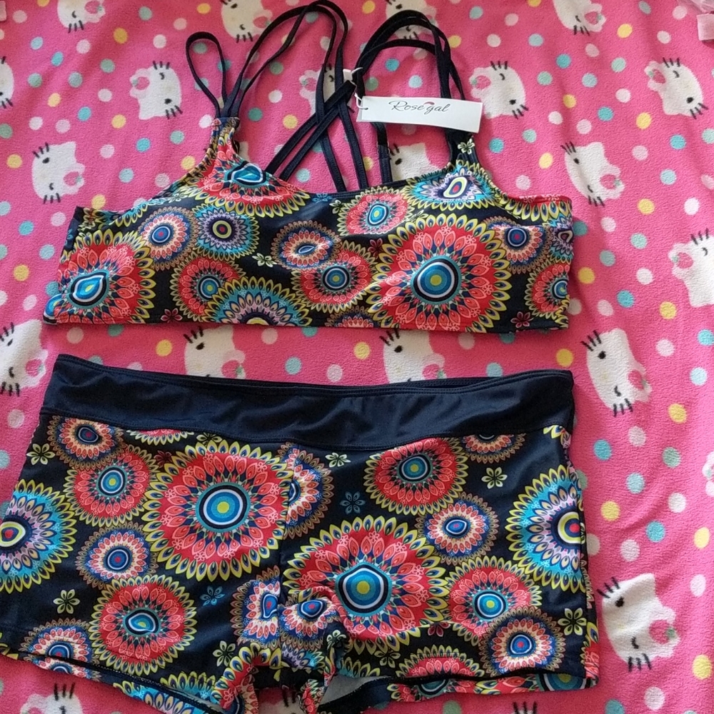 Two piece swim suit with cover up.